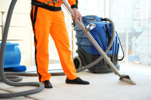 IICRC certified technician cleaning carpet