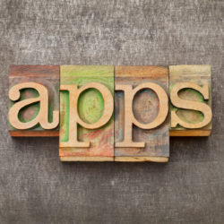 Multi-Family Property Mobile Apps in Wood Letters On Background