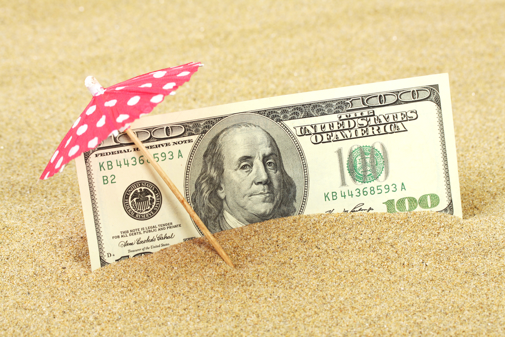 American One Hundred Dollar Bill In The Sand Under Umbrella For How Much Do Property Managers Make Blog