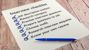 Property Management interview checklist on wooden table with a blue ball pen and tickmarks 3D illustration
