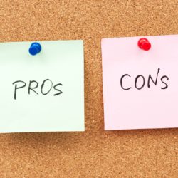 Two Note Pads on Cork Board For Pros and Cons of Flat Roofing Systems Blog Header