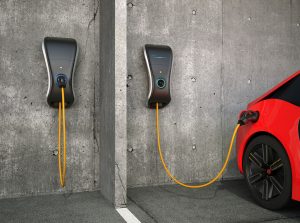 EV Charging Station Mounted To Parking Garage Wall Charging Car