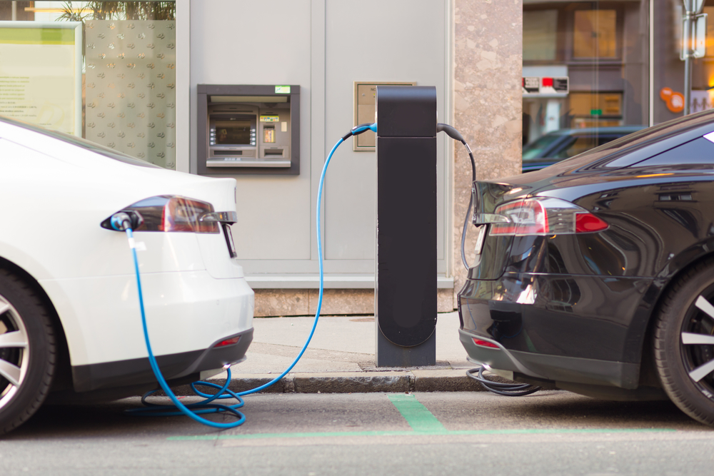 Two Electric Vehicles Charging At Commercial EV Charging Stations