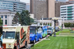 Line of Food Trucks Outside Apartment Complex For Property Managers And Food Trucks What You Need To Know Blog