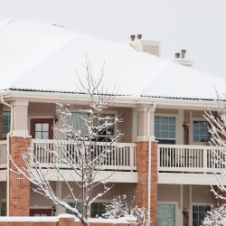 Snow Covered Apartment Building Seeking Rental Property Tenants In Winter
