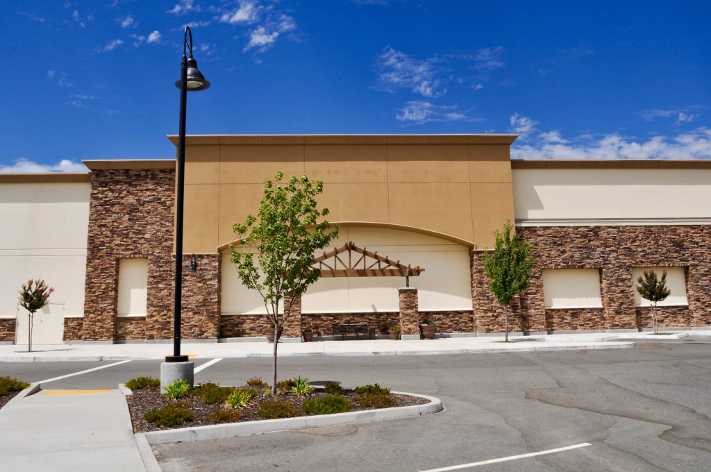 A Shopping Center's Landscaping Can Include Trees In Planters