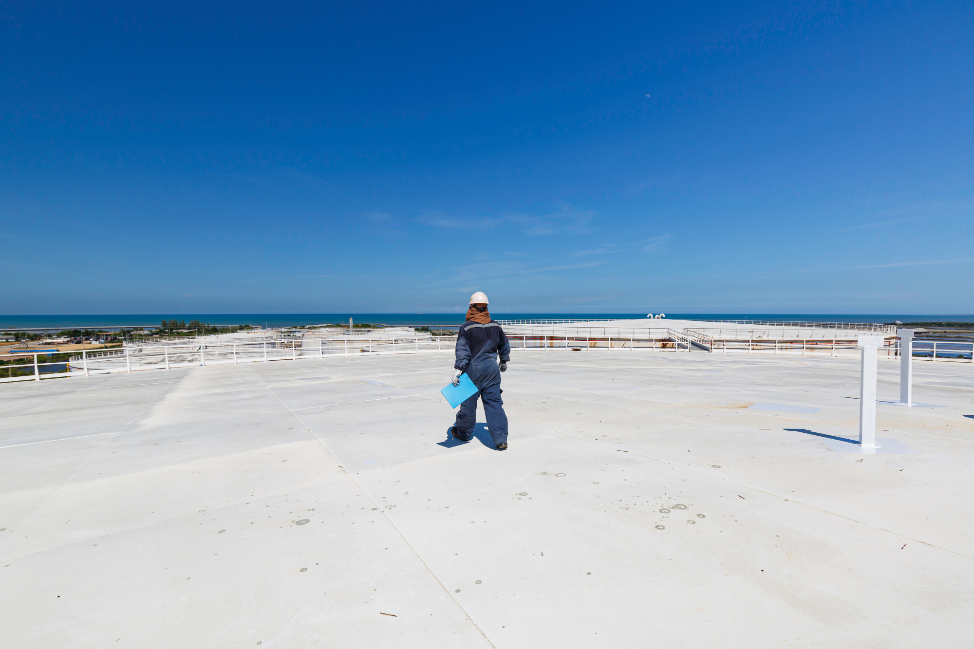 Commercial Roof Inspector On Flat Roof To Prepare A Commercial Roofing Estimate